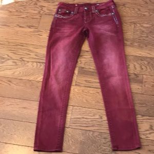 Miss Me maroon skinny jeans.